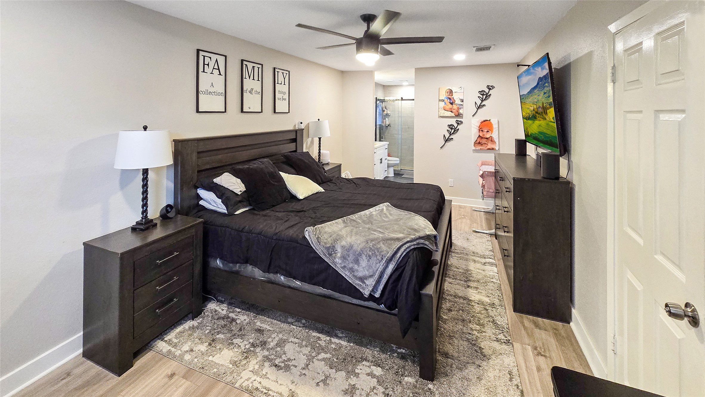 22531 John Rolfe Lane Katy, TX 77449 - Photo 11 of 19 a bedroom with a bed and wooden floor