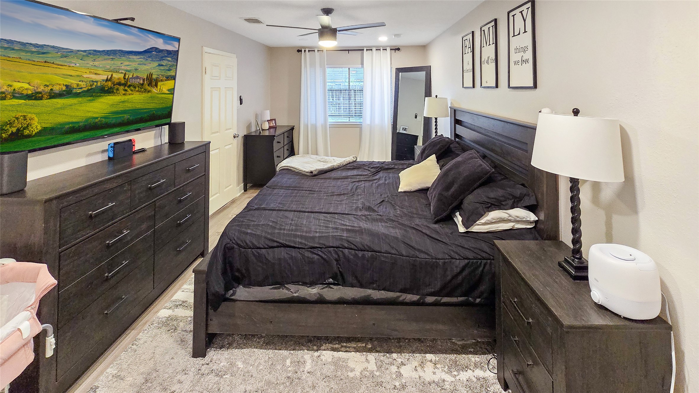 22531 John Rolfe Lane Katy, TX 77449 - Photo 12 of 19 a living room with furniture and a flat screen tv