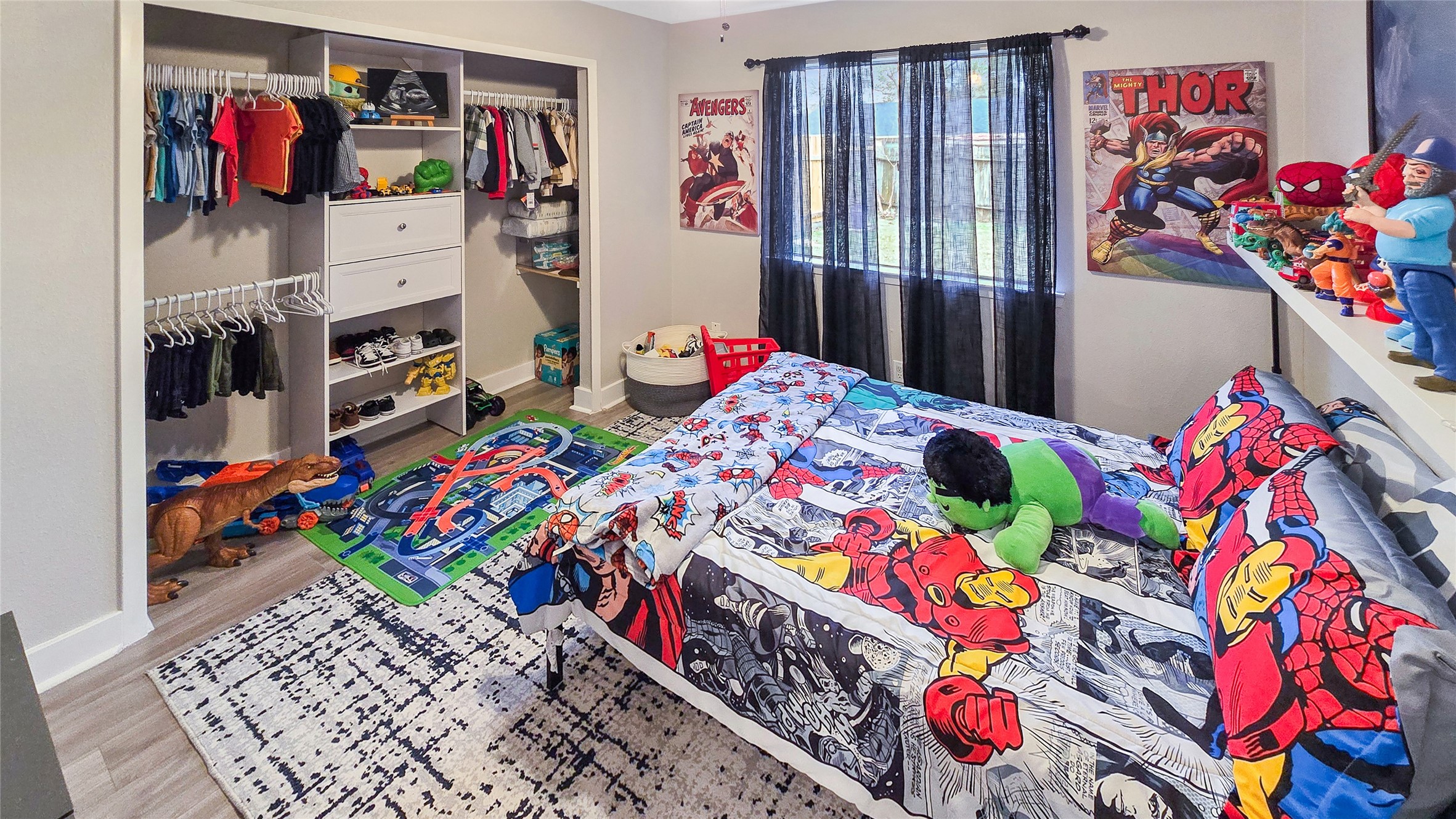 22531 John Rolfe Lane Katy, TX 77449 - Photo 16 of 19 a bed room with a bed and a book shelf