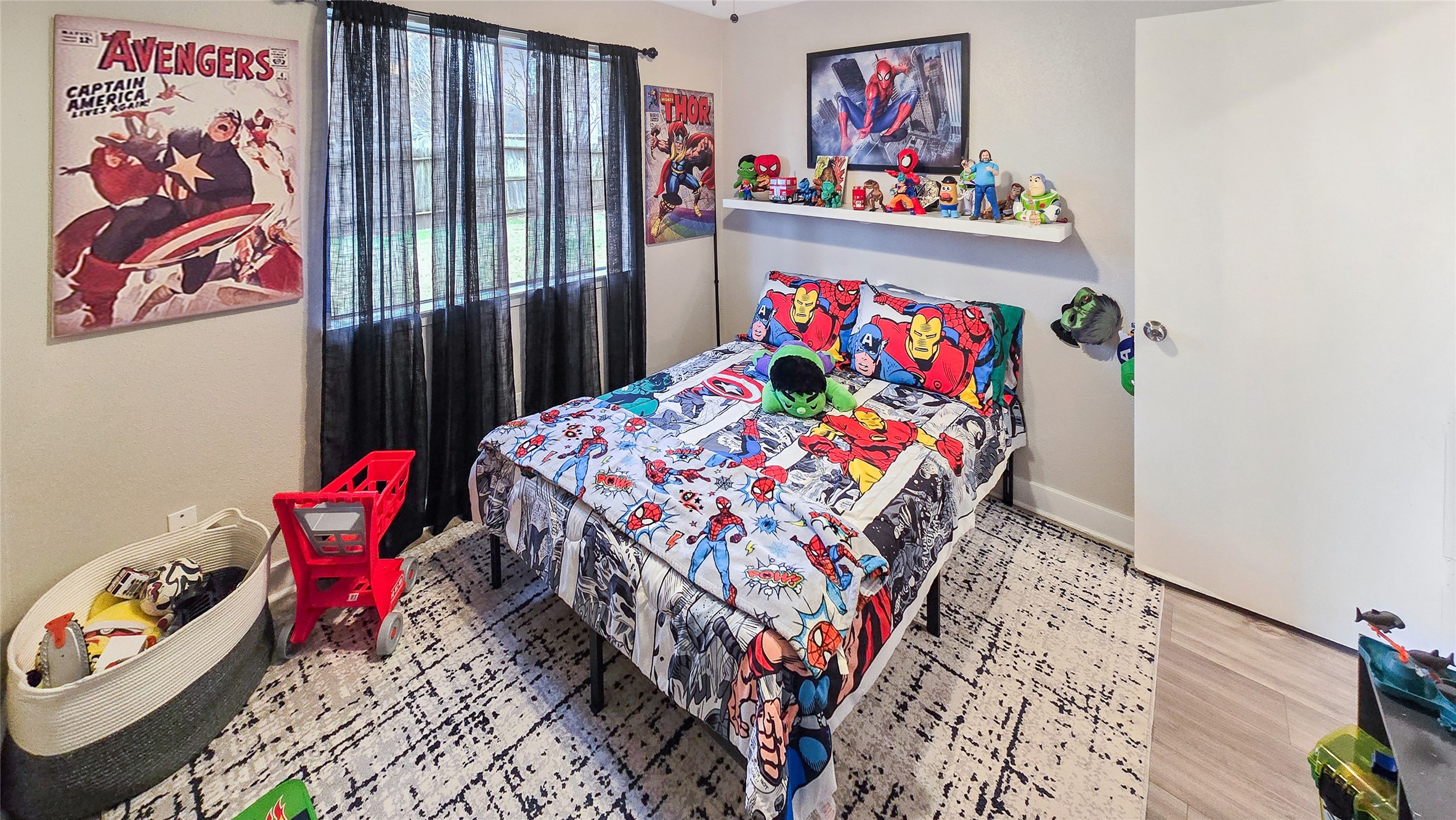 22531 John Rolfe Lane Katy, TX 77449 - Photo 18 of 19 kids bedroom with toys and wooden floor