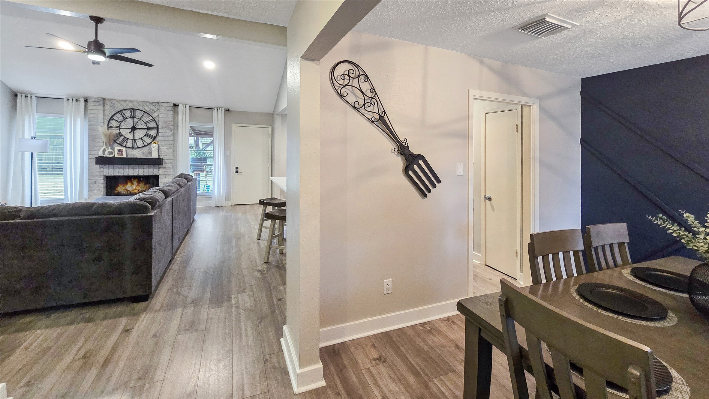 22531 John Rolfe Lane Katy, TX 77449 - Photo 2 of 19 a view of a hallway with wooden floor and staircase