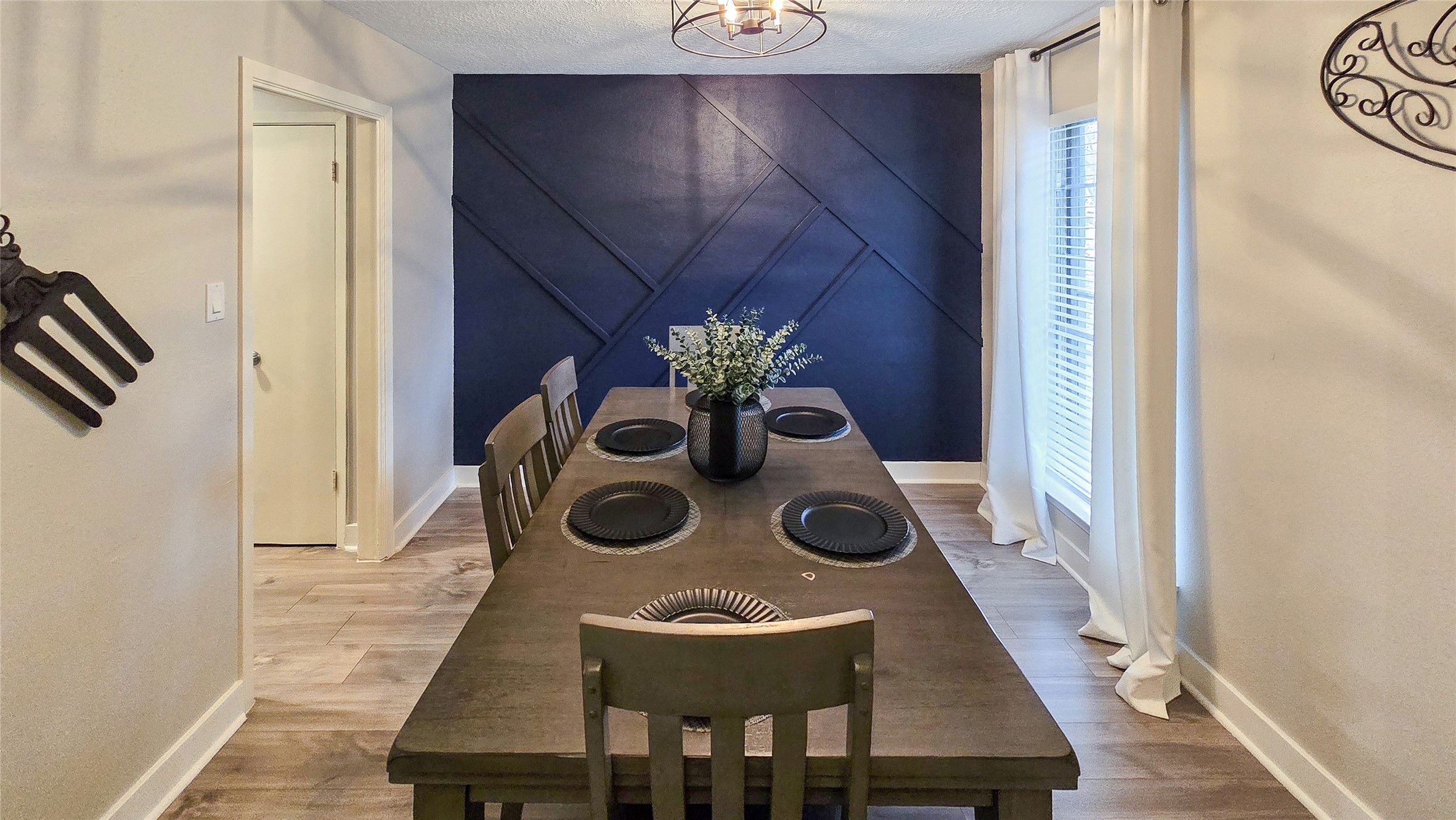 22531 John Rolfe Lane Katy, TX 77449 - Photo 3 of 19 a view of a dining room with chairs and chandelier