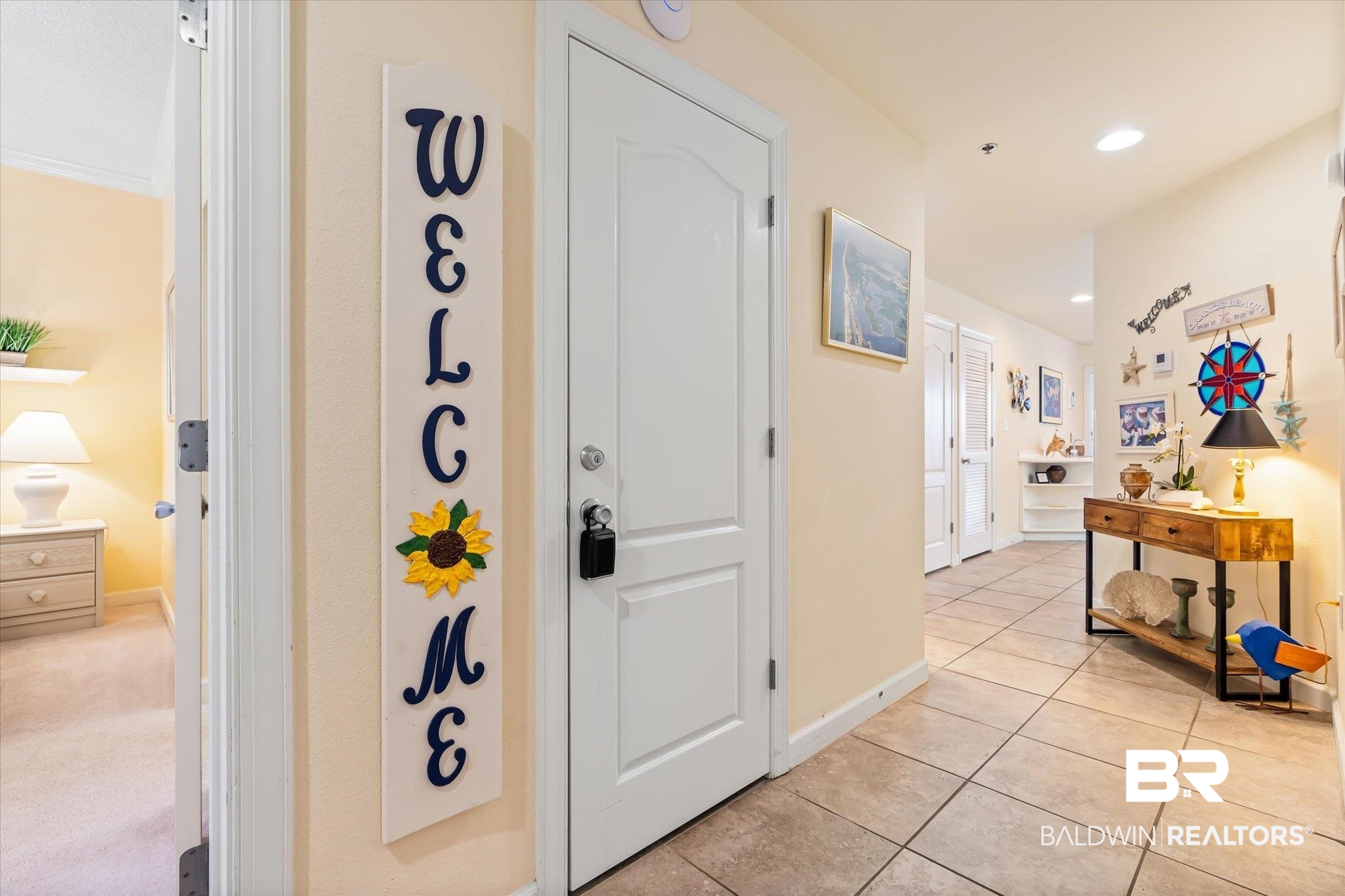 27770 Canal Road, Unit 2304 Orange Beach, AL 36561 - Photo 5 of 30 Corridor with recessed lighting, baseboards, and light tile patterned floors