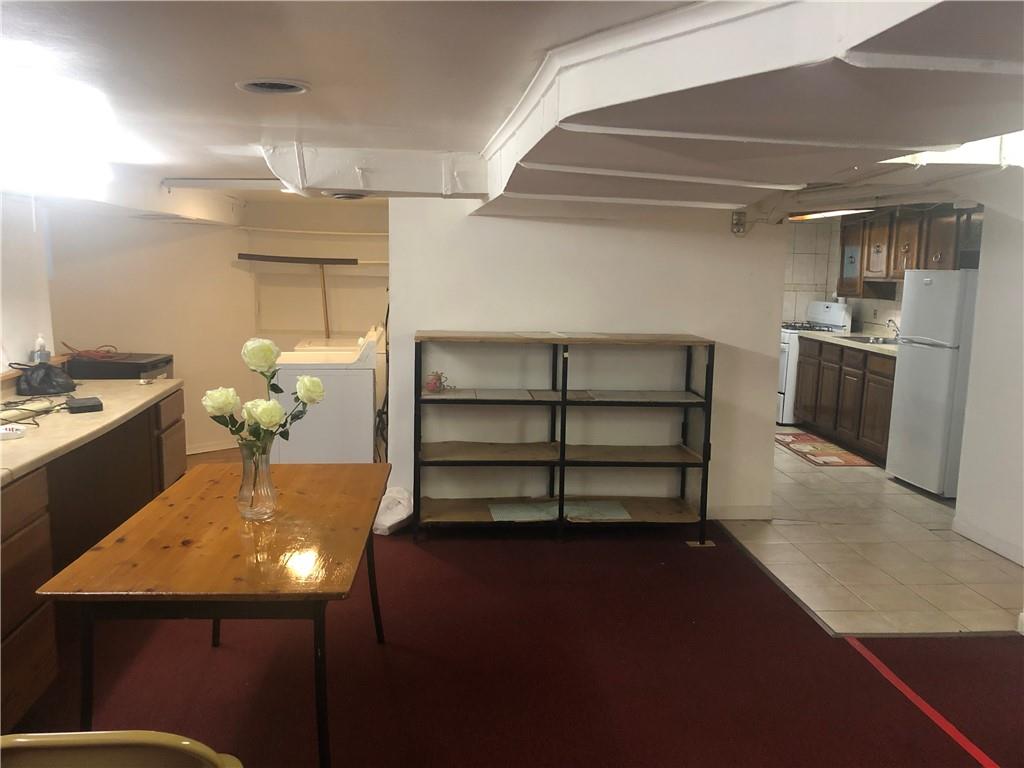 420 Stratford Road Brooklyn, NY 11218 - Photo 18 of 20 a view of a room with shelves