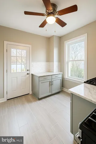 a view of an empty room with a window