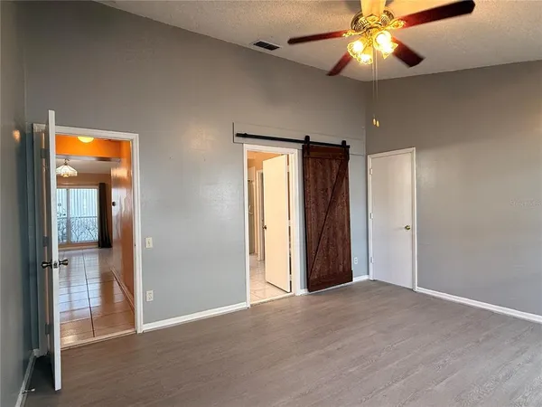 a view of an empty room with a fan