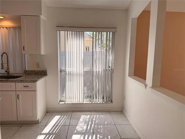 a view of a kitchen with a sink