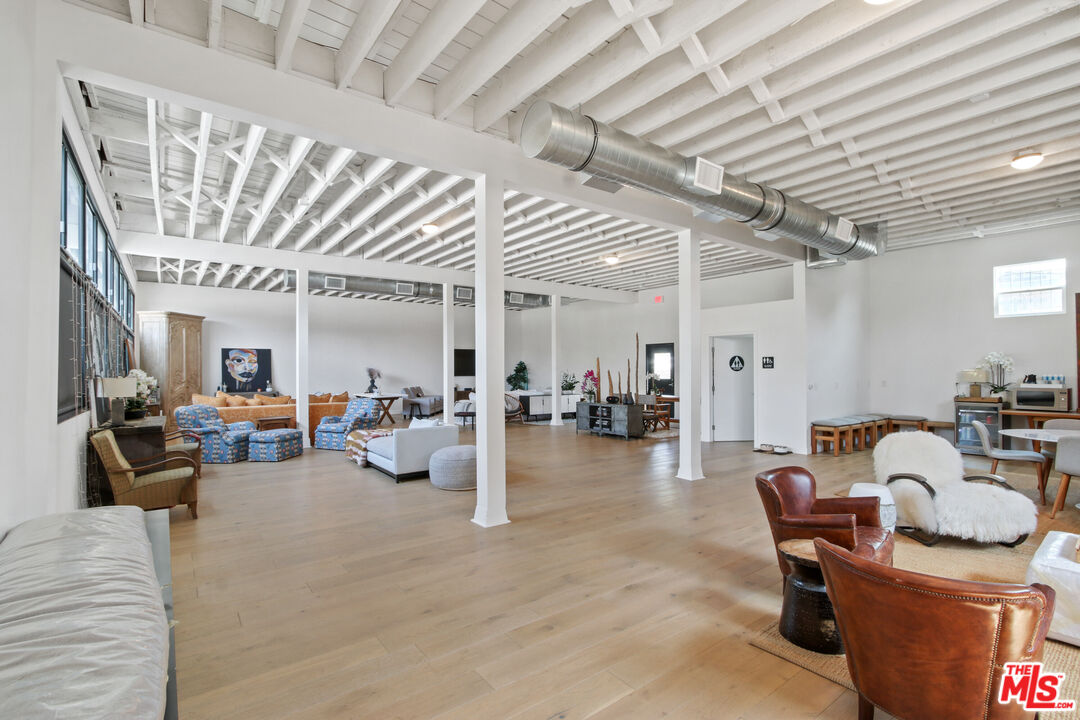 2331 4th Street Santa Monica, CA 90405 - Photo 6 of 10 a living room with furniture and a chandelier