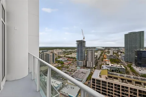 a view of roof deck with couch and city view