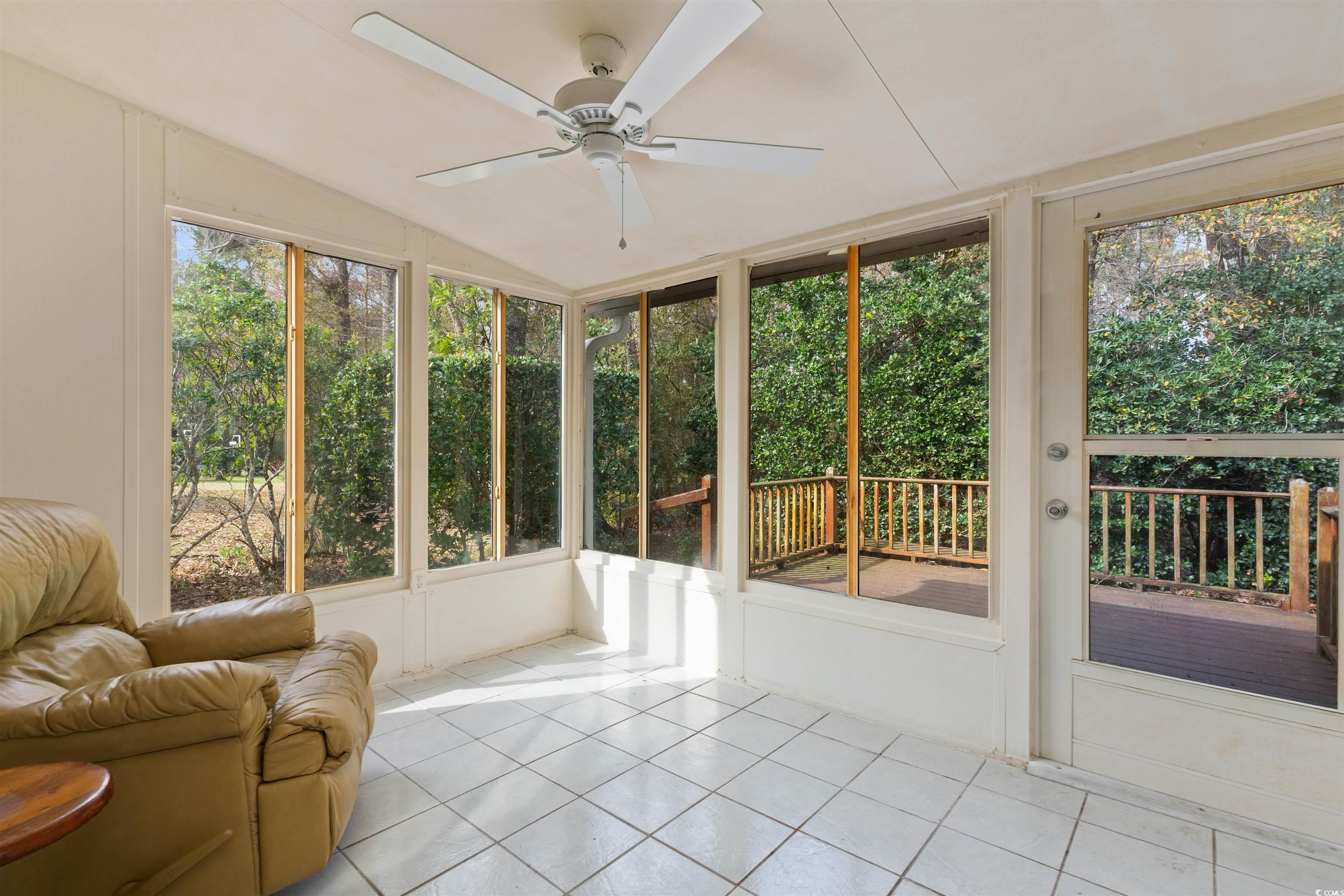 675 Bluebird Lane Murrells Inlet, SC 29576 - Photo 31 of 40 Sunroom featuring a ceiling fan and vaulted ceilin