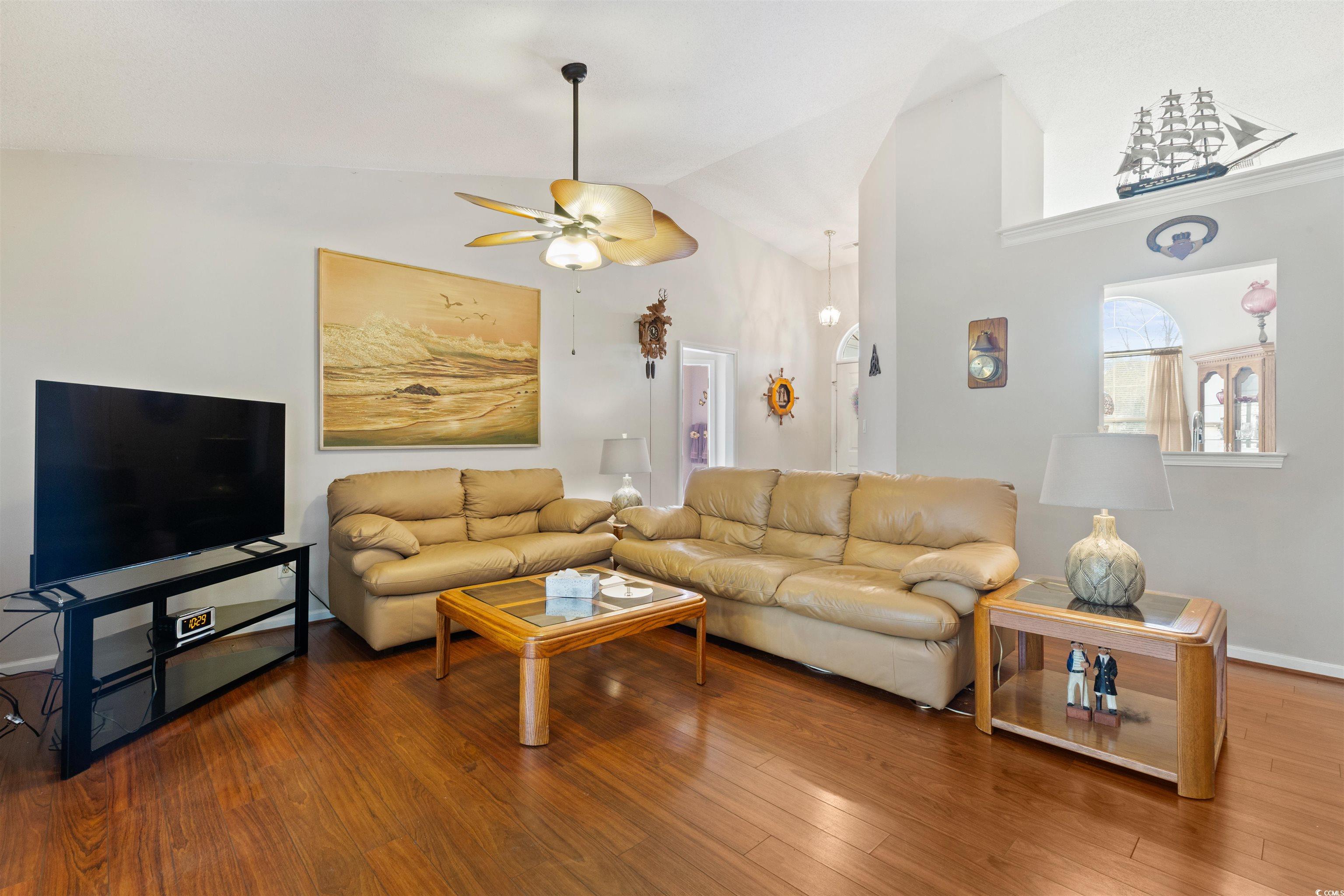 675 Bluebird Lane Murrells Inlet, SC 29576 - Photo 8 of 40 Living room featuring high vaulted ceiling, wood f
