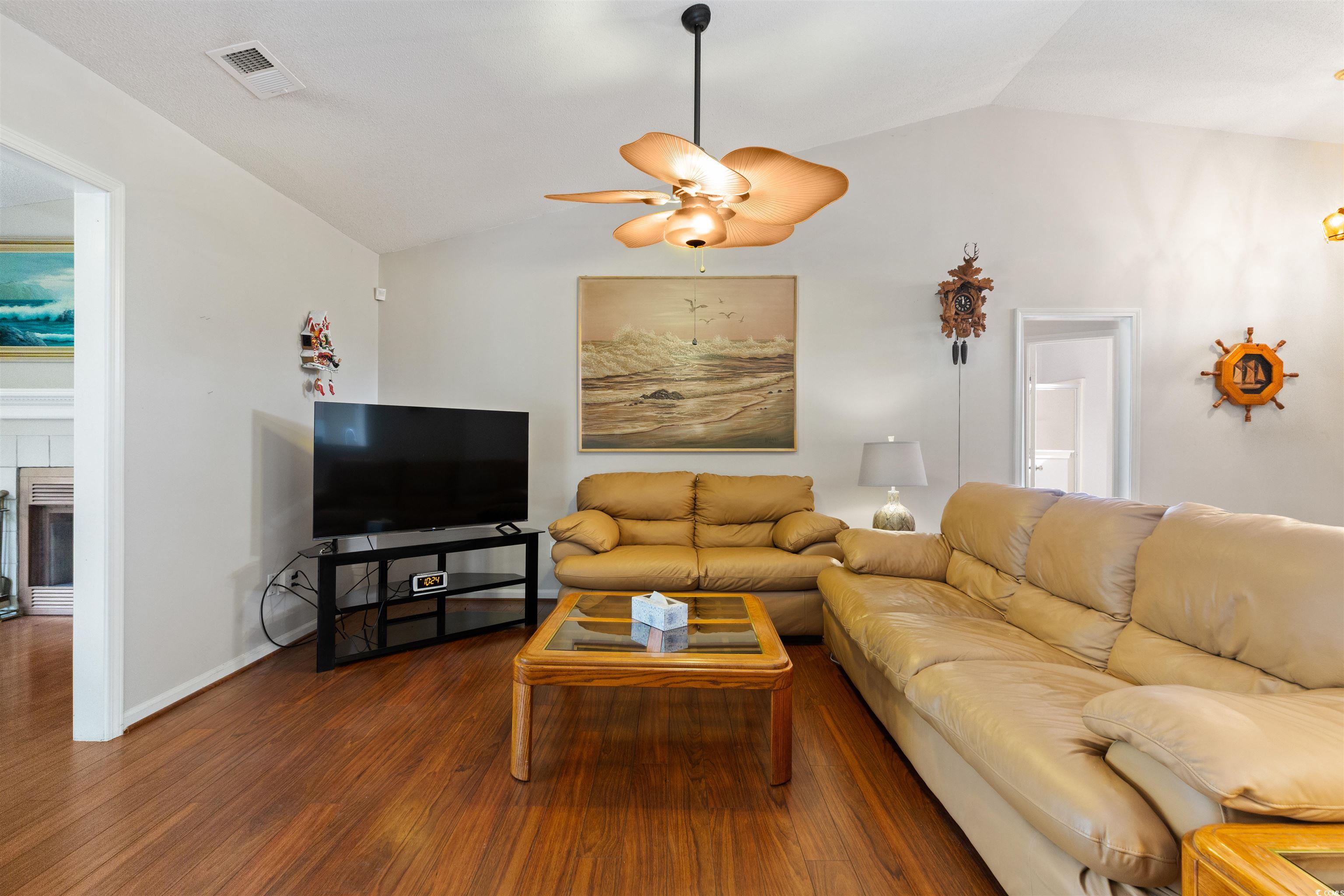 675 Bluebird Lane Murrells Inlet, SC 29576 - Photo 9 of 40 Living area featuring visible vents, a ceiling fan