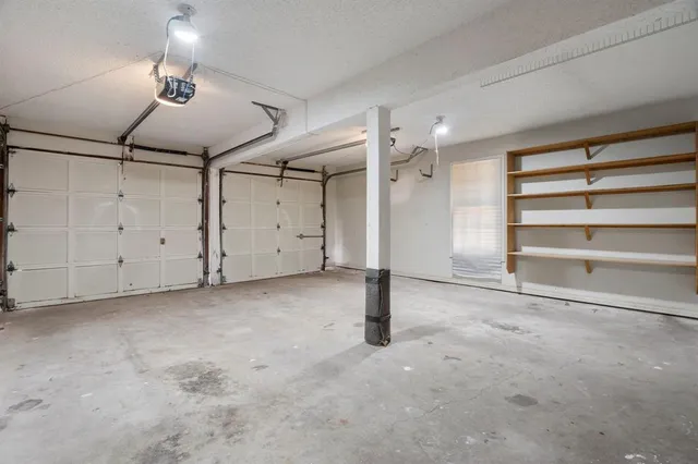 a view of an empty room with a ceiling fan