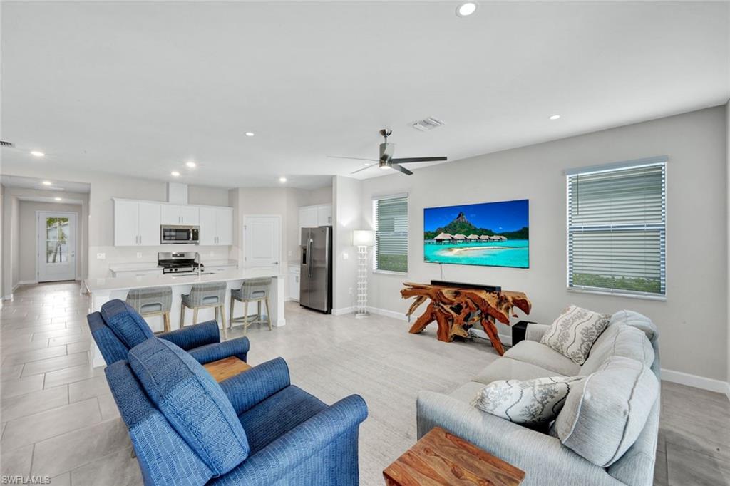 18298 Ridgeline Drive Estero, FL 33928 - Photo 11 of 49 Living room featuring recessed lighting and ceiling fan