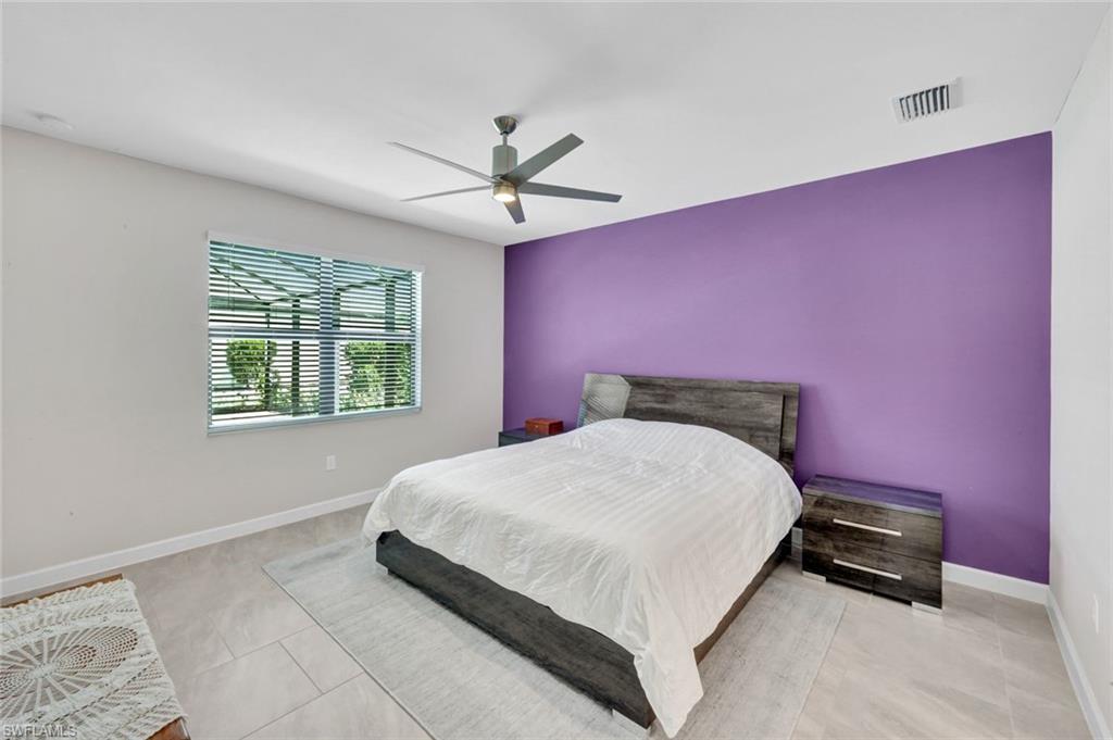 18298 Ridgeline Drive Estero, FL 33928 - Photo 18 of 49 Bedroom with a ceiling fan and an accent wall