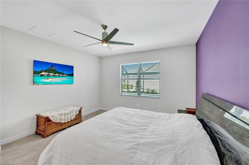 18298 Ridgeline Drive Estero, FL 33928 - Photo 19 of 49 Bedroom featuring a ceiling fan and baseboards