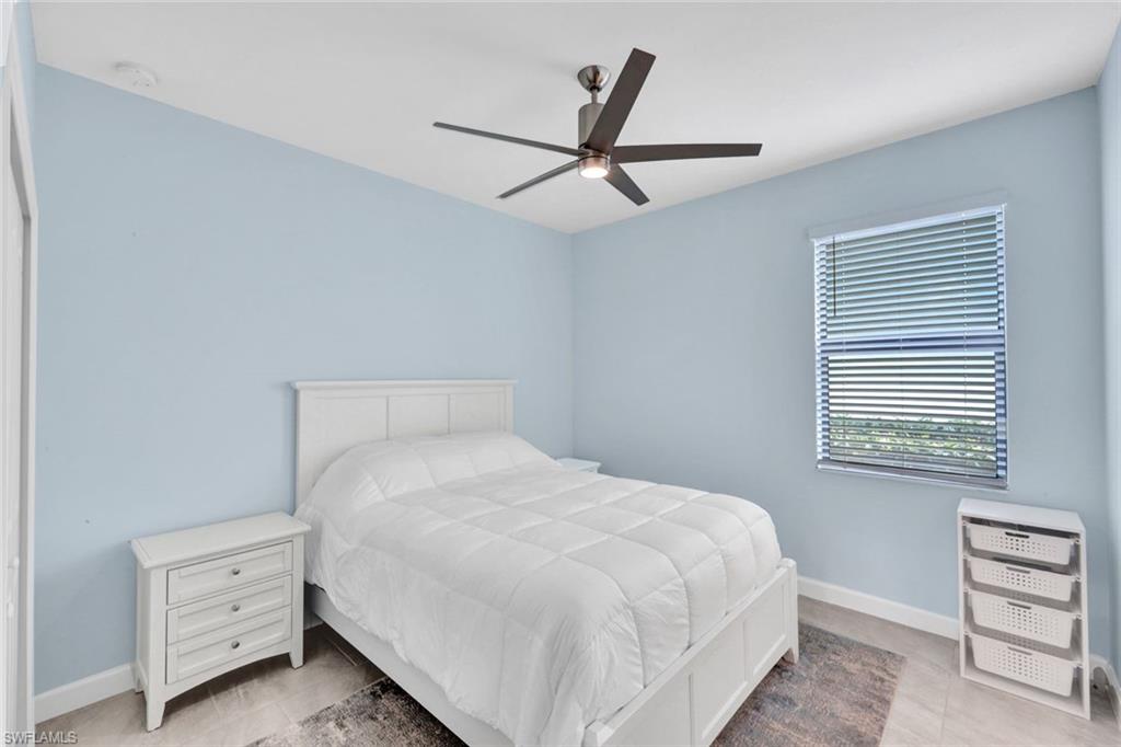18298 Ridgeline Drive Estero, FL 33928 - Photo 22 of 49 Bedroom with baseboards and a ceiling fan