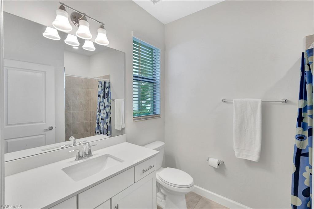 18298 Ridgeline Drive Estero, FL 33928 - Photo 23 of 49 Bathroom featuring vanity and a shower with shower curtain