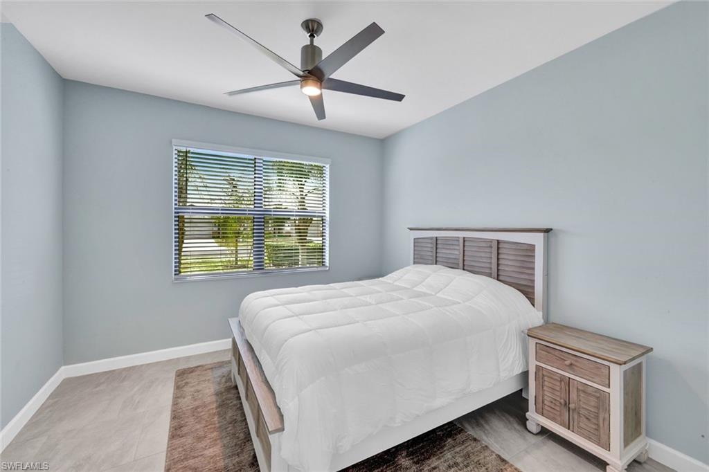 18298 Ridgeline Drive Estero, FL 33928 - Photo 24 of 49 Bedroom featuring baseboards and ceiling fan
