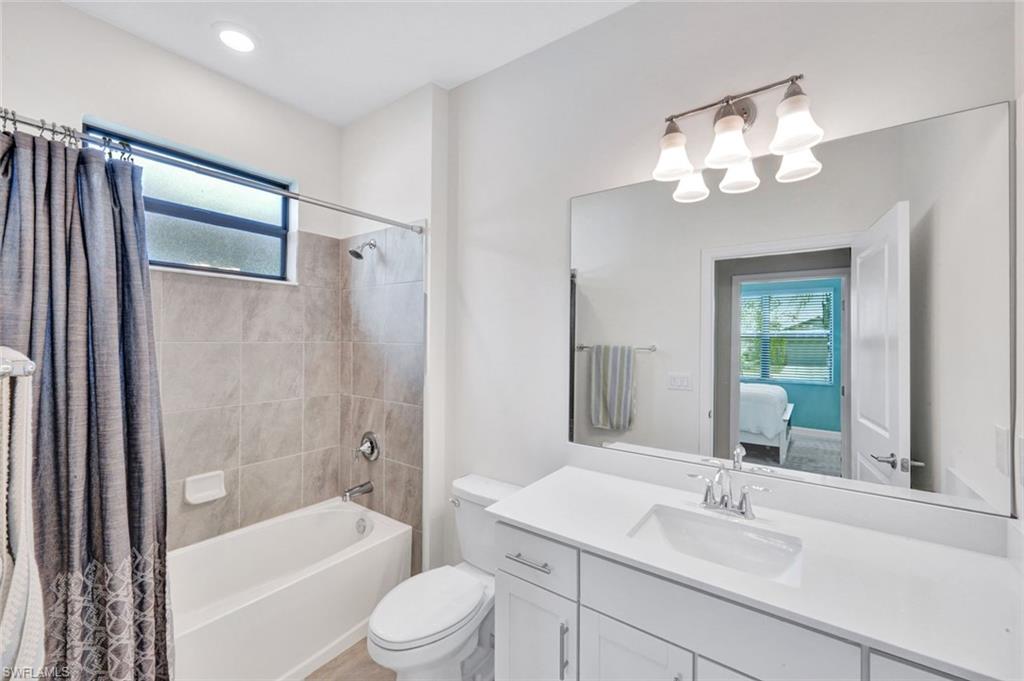 18298 Ridgeline Drive Estero, FL 33928 - Photo 25 of 49 Full bath with plenty of natural light, ensuite bathroom, vanity, and shower / tub combo