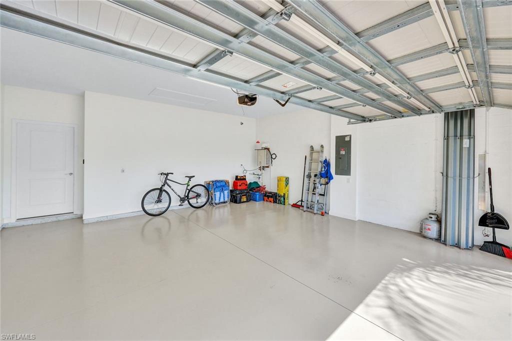 18298 Ridgeline Drive Estero, FL 33928 - Photo 27 of 49 Garage featuring electric panel