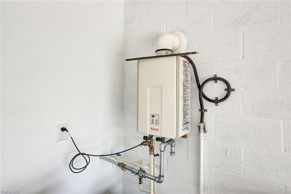18298 Ridgeline Drive Estero, FL 33928 - Photo 36 of 49 Detailed view of concrete block wall and water heater