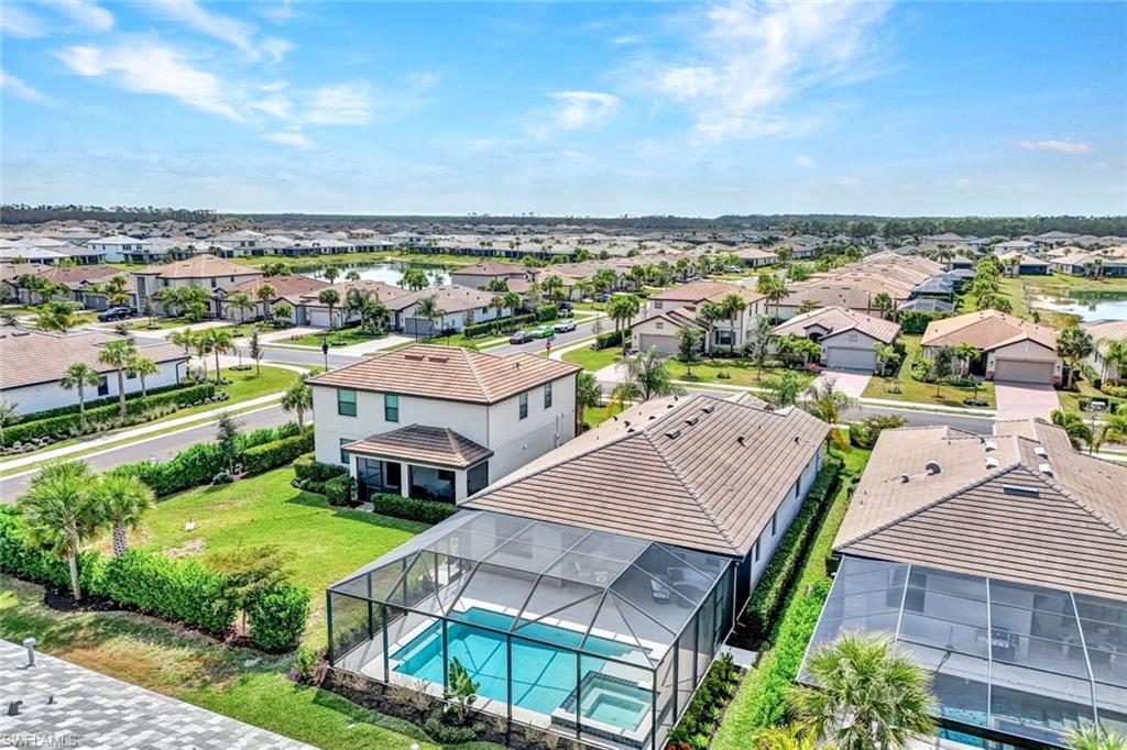 18298 Ridgeline Drive Estero, FL 33928 - Photo 37 of 49 Aerial view of residential area featuring a pool area