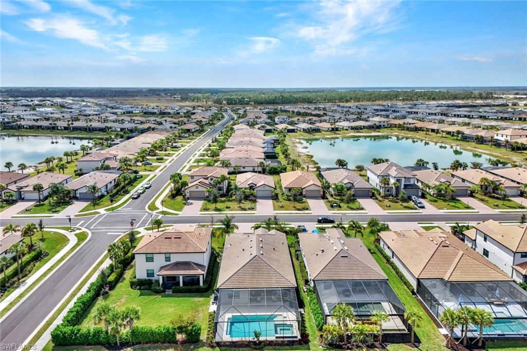 18298 Ridgeline Drive Estero, FL 33928 - Photo 39 of 49 Aerial perspective of suburban area with a large body of water