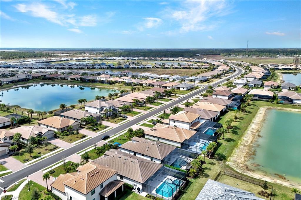 18298 Ridgeline Drive Estero, FL 33928 - Photo 40 of 49 Aerial view of residential area featuring a large body of water