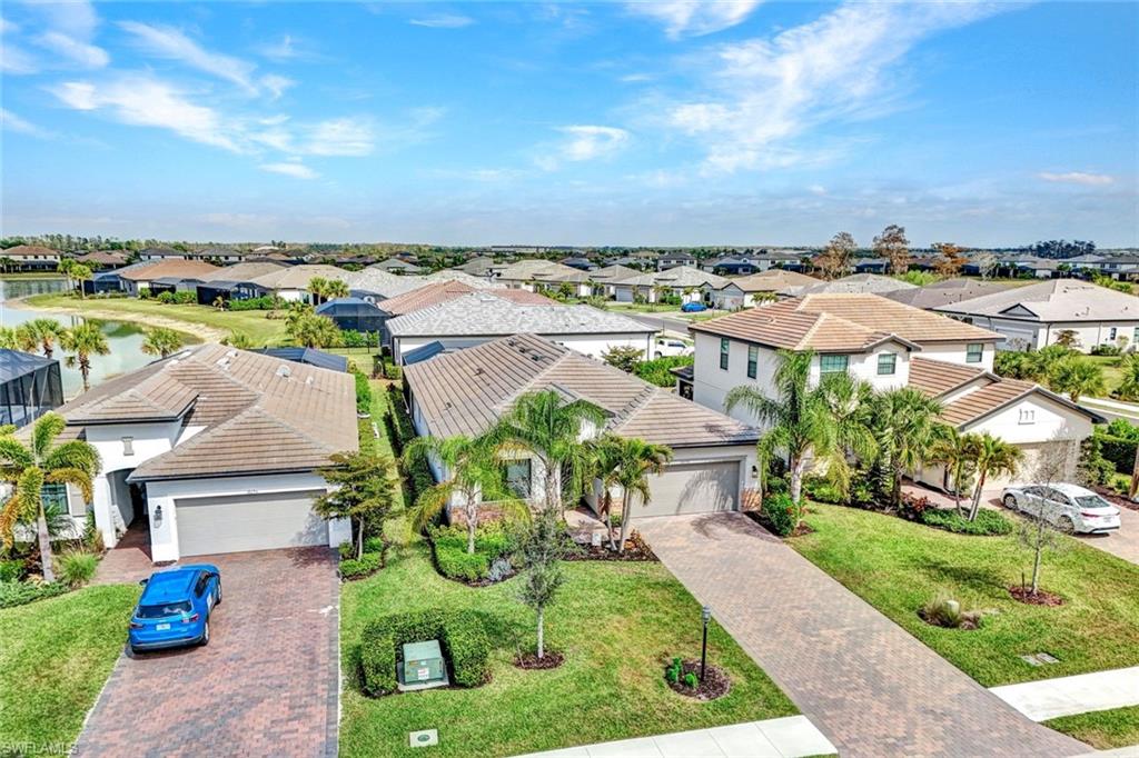 18298 Ridgeline Drive Estero, FL 33928 - Photo 4 of 49 Aerial perspective of suburban area