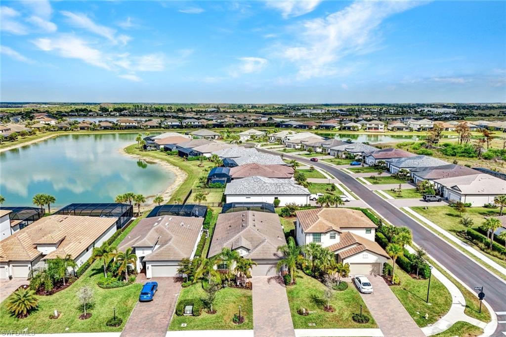 18298 Ridgeline Drive Estero, FL 33928 - Photo 5 of 49 Aerial perspective of suburban area featuring a large body of water