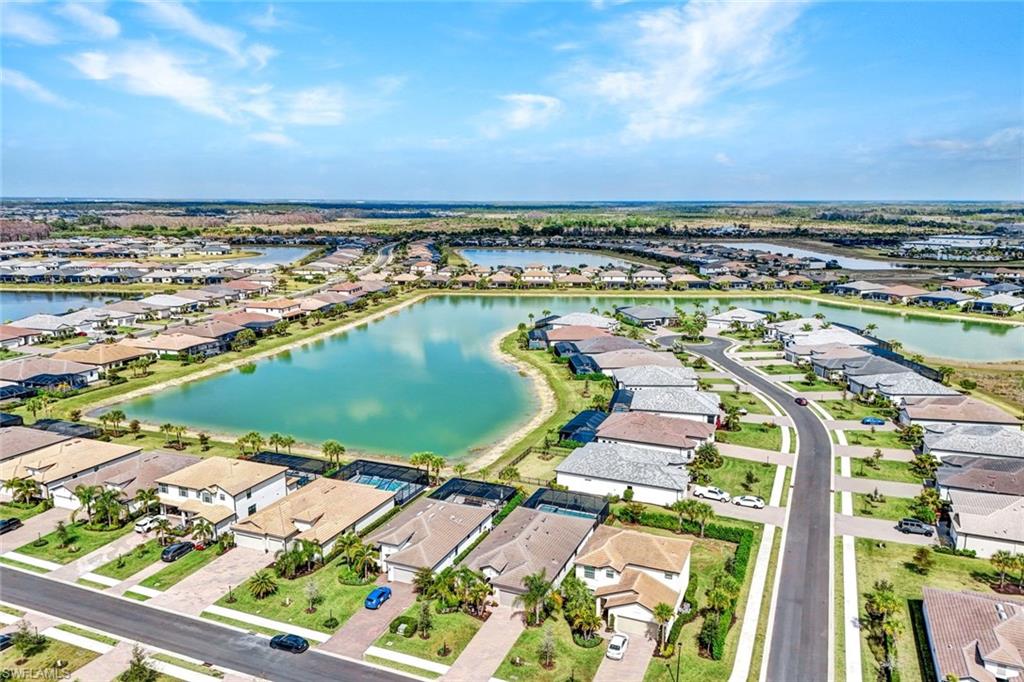 18298 Ridgeline Drive Estero, FL 33928 - Photo 6 of 49 Aerial view of residential area with a large body of water