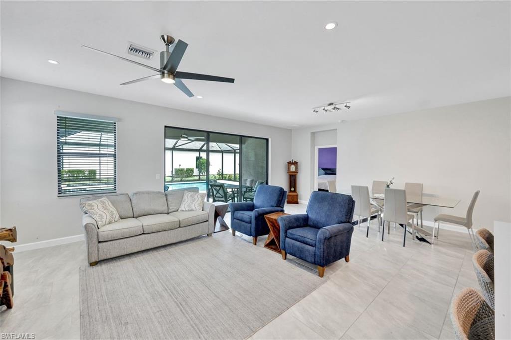 18298 Ridgeline Drive Estero, FL 33928 - Photo 9 of 49 Living area featuring a sunroom, ceiling fan, and recessed lighting