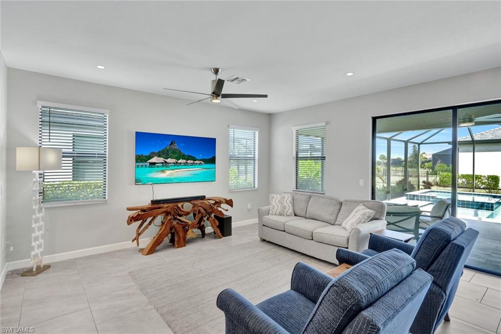 18298 Ridgeline Drive Estero, FL 33928 - Photo 10 of 49 Living area with a ceiling fan, a sunroom, and recessed lighting