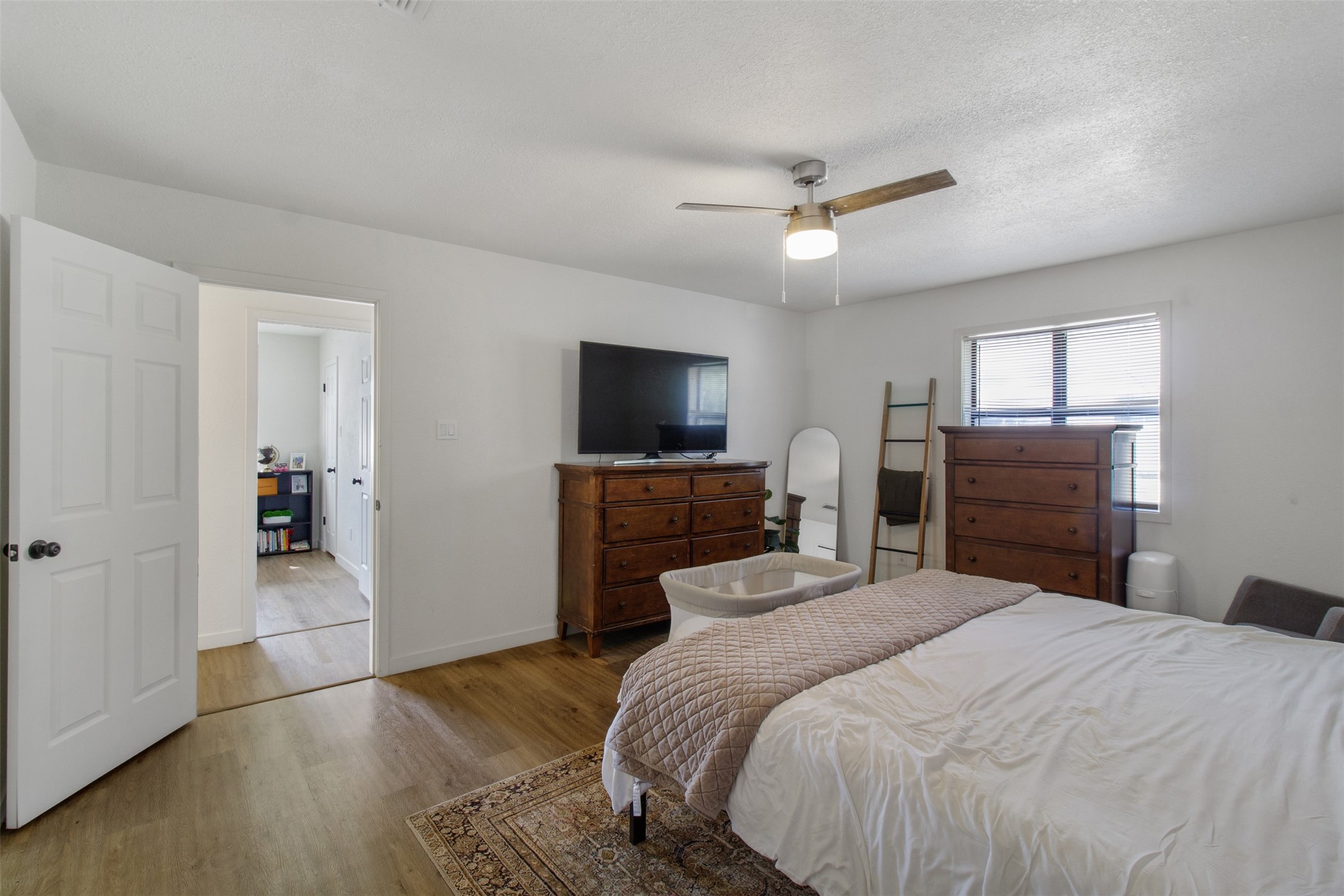 3908 Sierra Court Bryan, TX 77802 - Photo 14 of 27 a bedroom with a bed and a flat screen tv