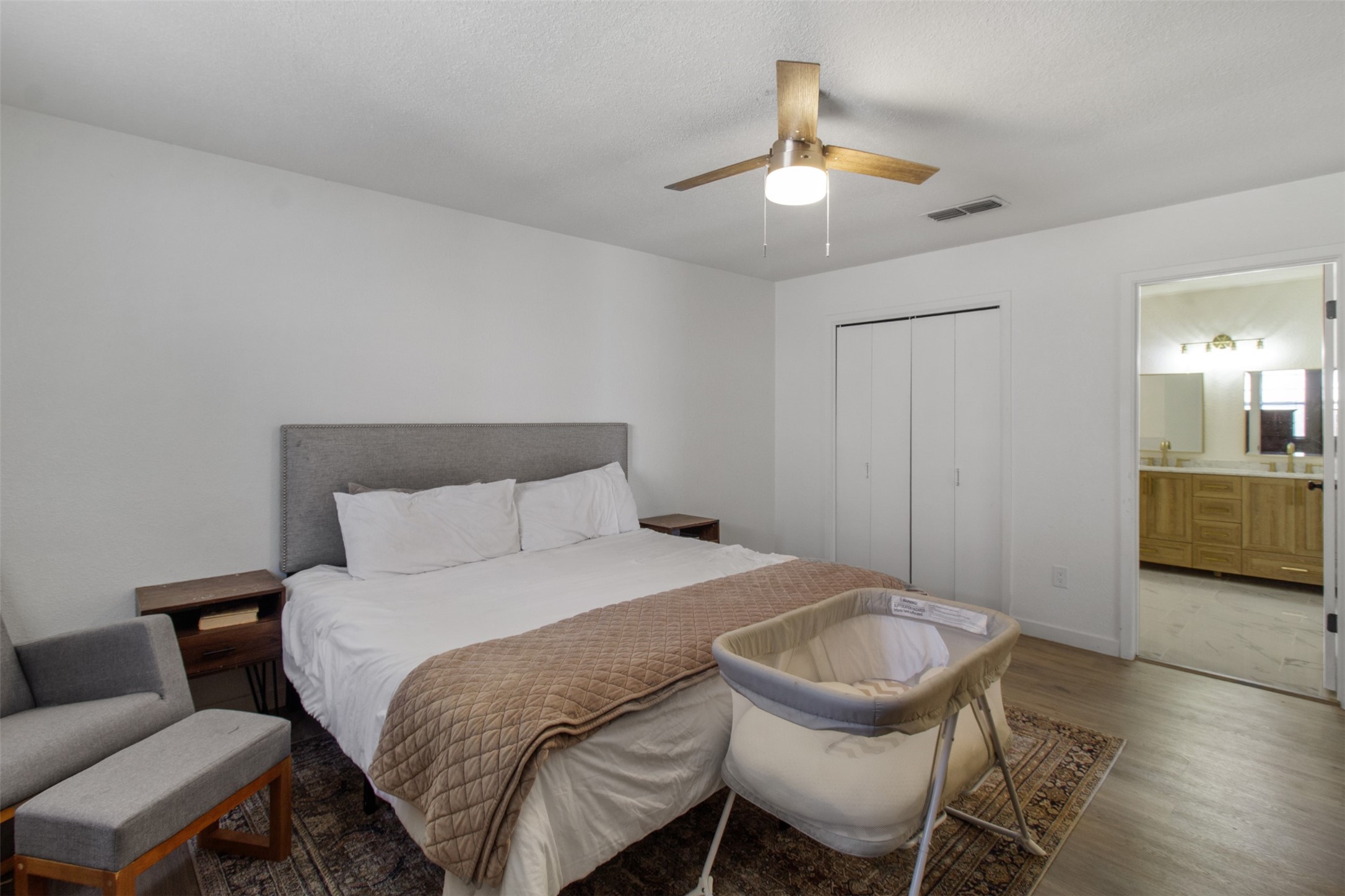 3908 Sierra Court Bryan, TX 77802 - Photo 15 of 27 a bedroom with a bed and chandelier