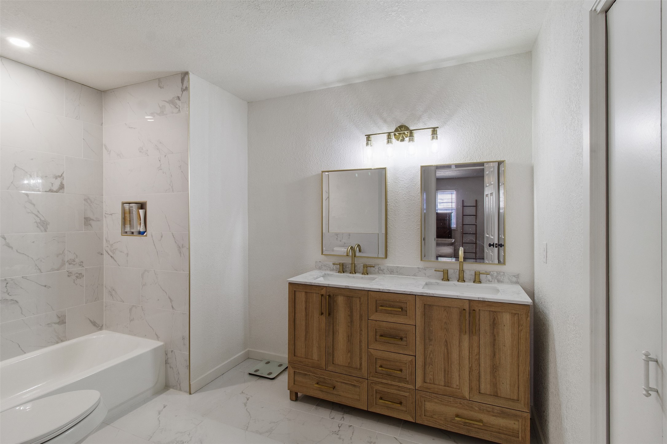 3908 Sierra Court Bryan, TX 77802 - Photo 16 of 27 a bathroom with a tub sink and mirror