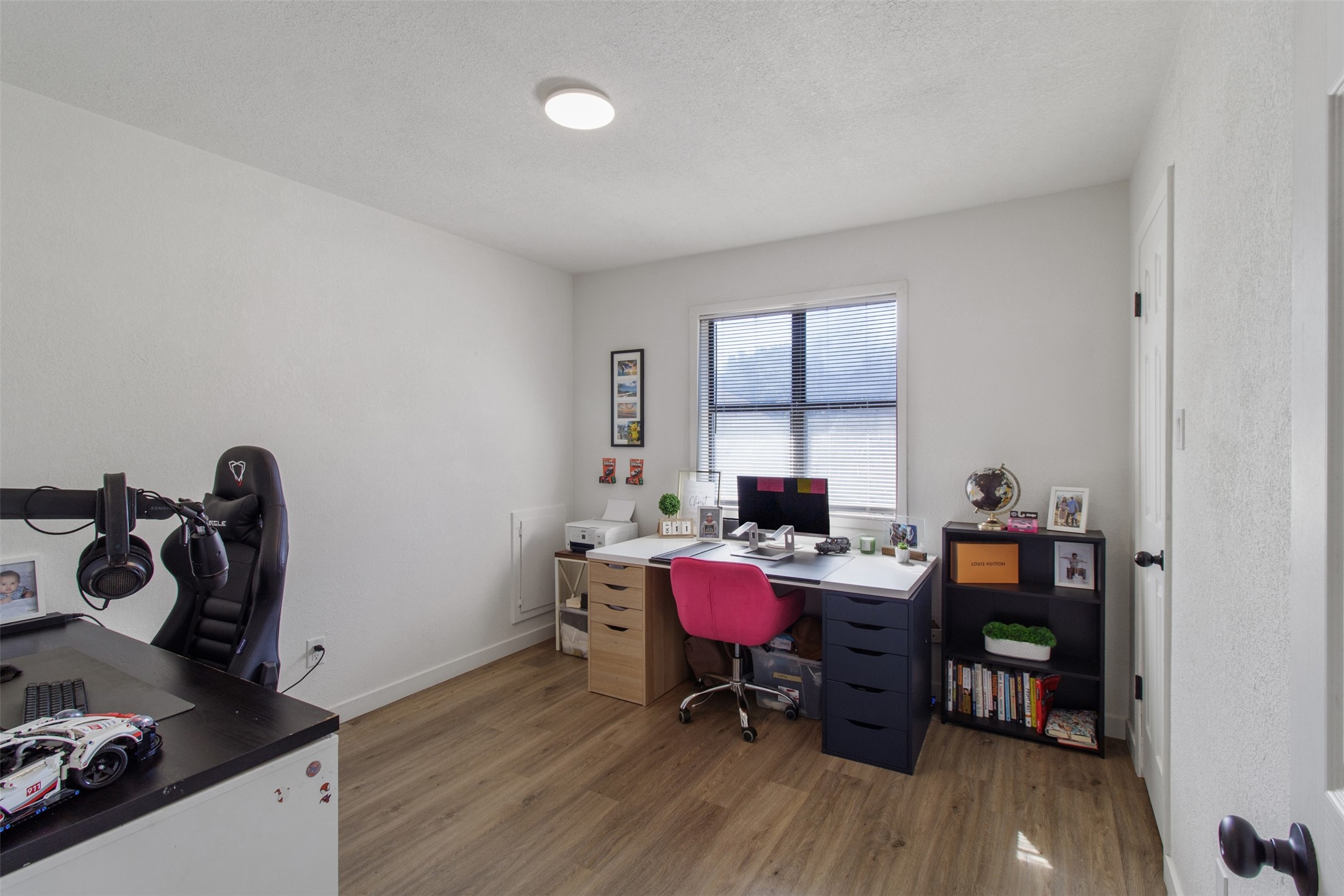 3908 Sierra Court Bryan, TX 77802 - Photo 22 of 27 a living room with furniture and a wooden floor