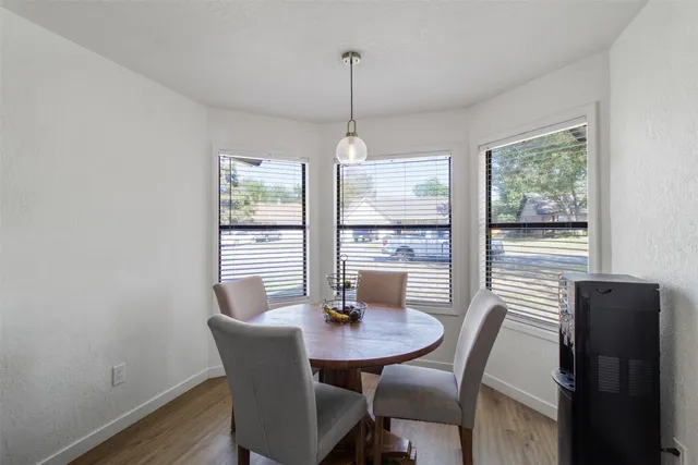 a view of a dining room with furniture window and outside view
