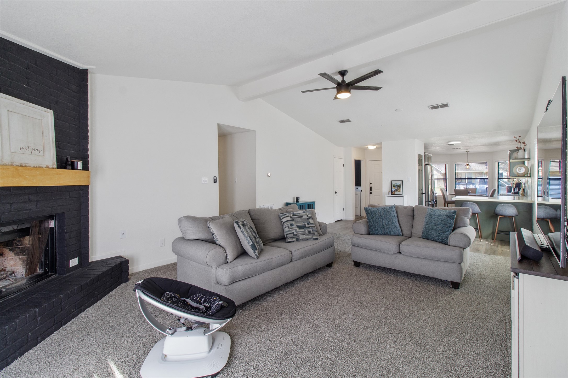 3908 Sierra Court Bryan, TX 77802 - Photo 10 of 27 a living room with furniture a fireplace and a flat screen tv