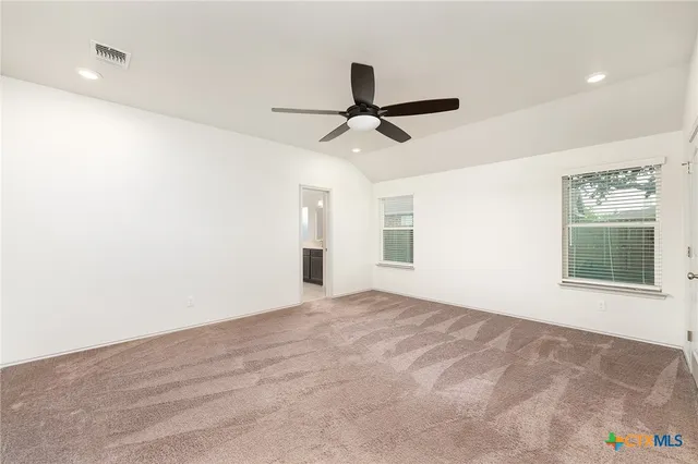 a view of an empty room with a window