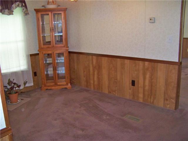 1636 Bend Road Clarksville, TN 37040 - Photo 4 of 20 THE SEPARATE DINING ROOM HAS PANELED WAINSCOATING UP TO THE CHAIR RAIL.