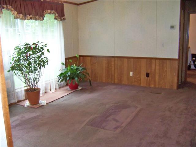 1636 Bend Road Clarksville, TN 37040 - Photo 6 of 20 THE LIVING ROOM ALSO HAS PANELED WAINSCOATING UP TO THE CHAIR RAIL.