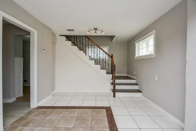 a view of entryway and hall with a window