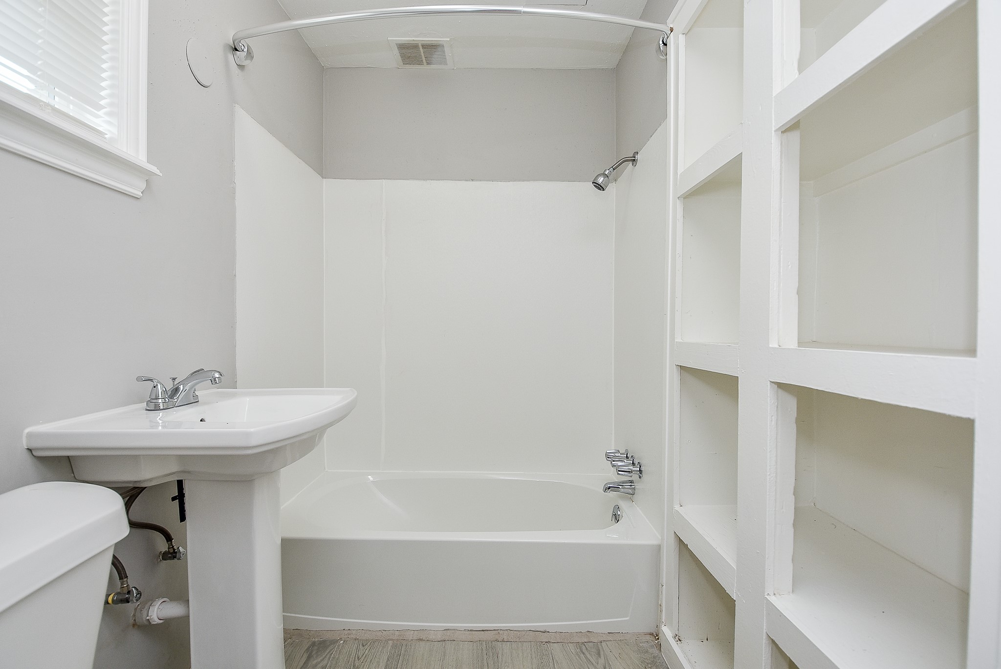 2509 Oakcliff Street Houston, TX 77023 - Photo 19 of 31 a bathroom with a sink a toilet and shower