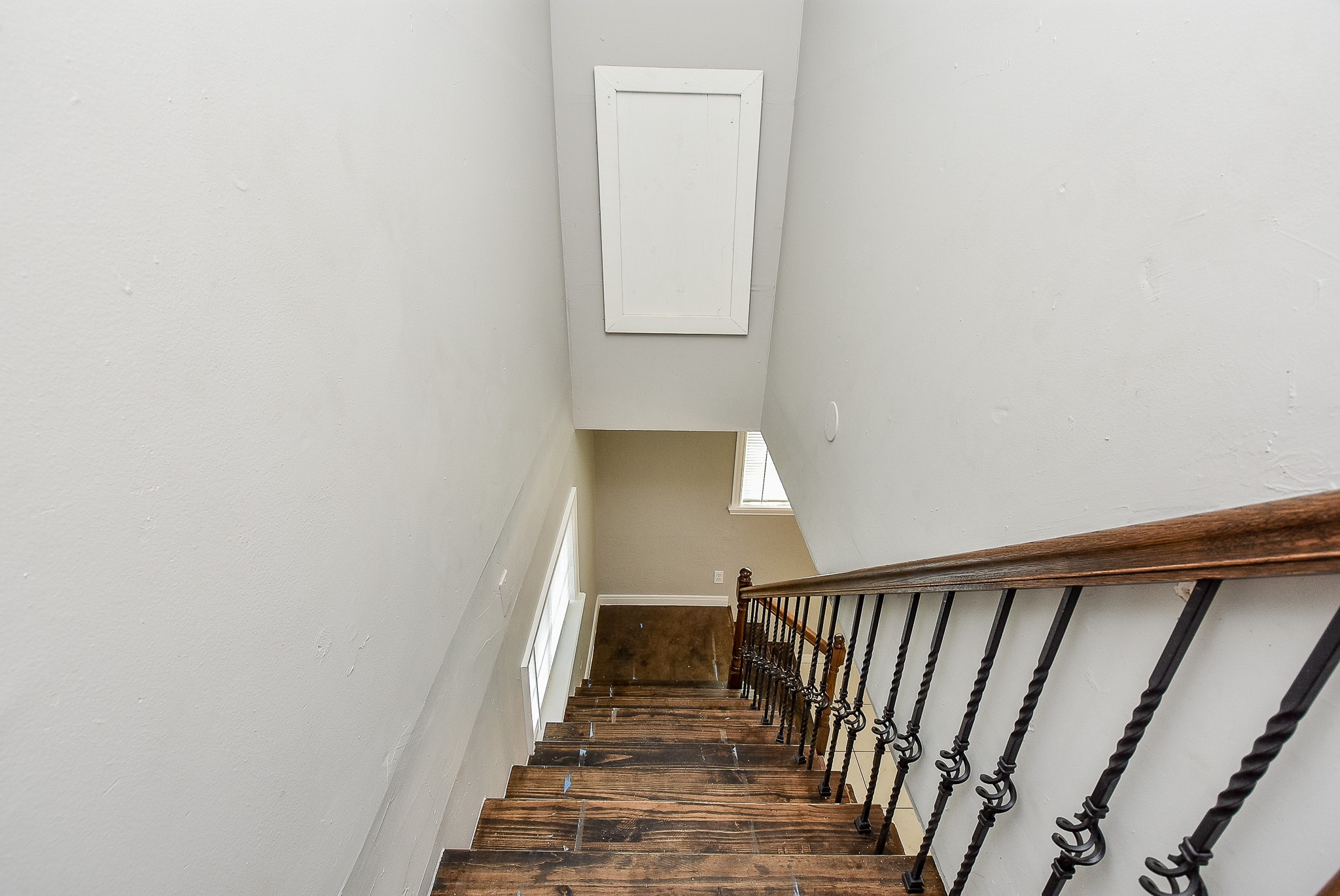 2509 Oakcliff Street Houston, TX 77023 - Photo 20 of 31 a view of a hallway with wooden floor and staircase