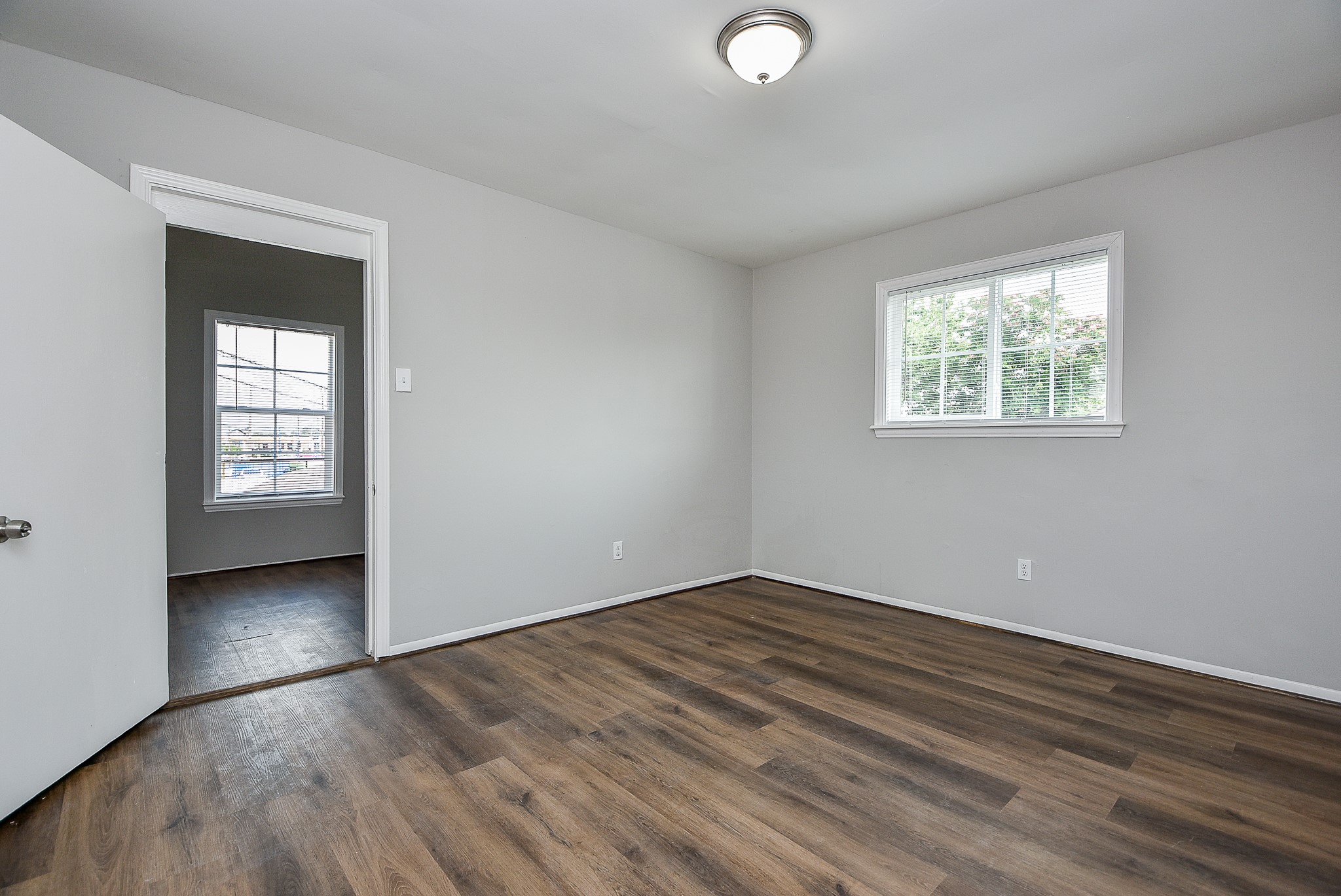 2509 Oakcliff Street Houston, TX 77023 - Photo 21 of 31 wooden floor in an empty room with a window