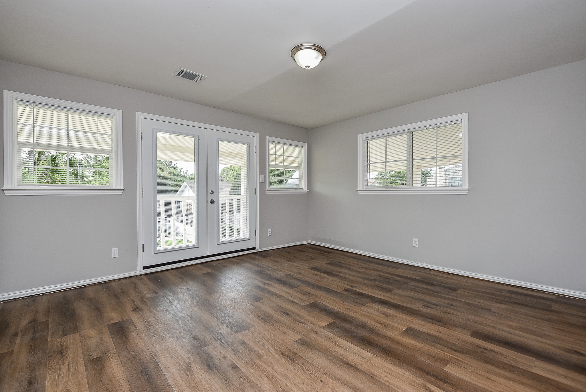 2509 Oakcliff Street Houston, TX 77023 - Photo 24 of 31 a view of an empty room with wooden floor and a window