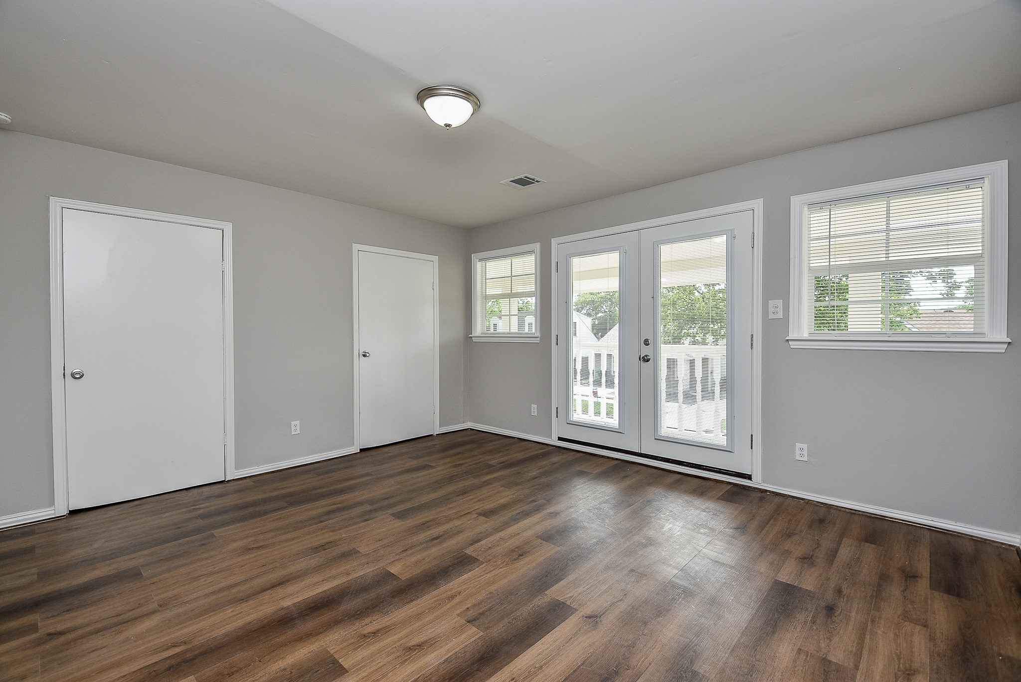 2509 Oakcliff Street Houston, TX 77023 - Photo 25 of 31 a view of an empty room with wooden floor and a window