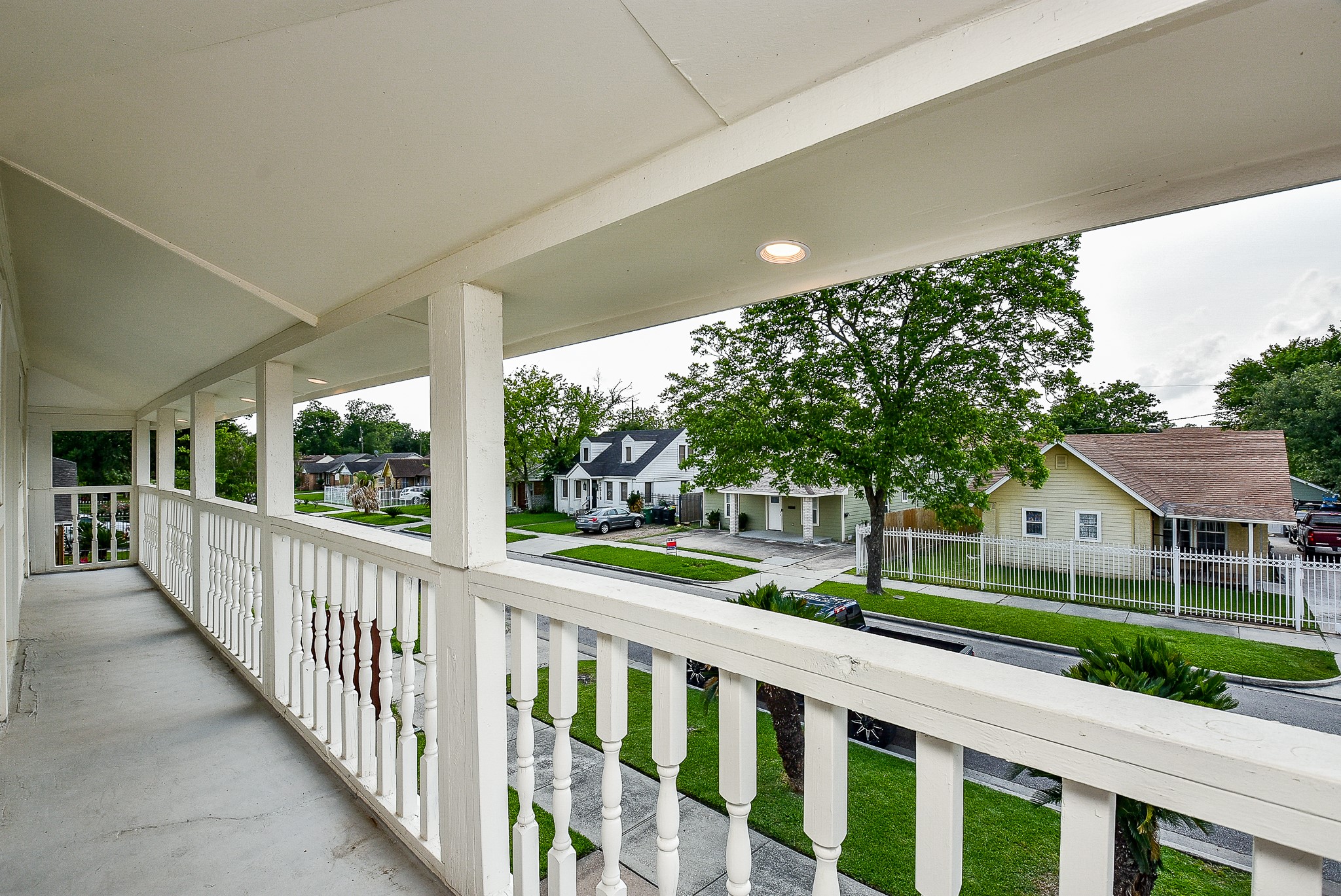2509 Oakcliff Street Houston, TX 77023 - Photo 27 of 31 a view of a porch with a floor to ceiling window and a yard
